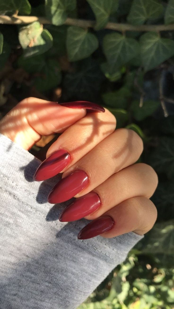 Striking Statement Cranberry Clothing With Coral Nails For A Bold Presence